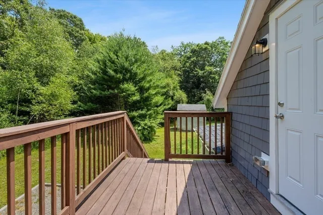 a view of balcony with wooden floor