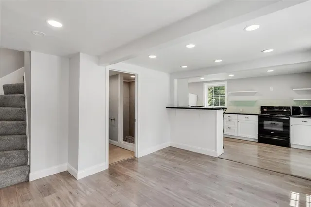 a view of a kitchen with a sink and a refrigerator