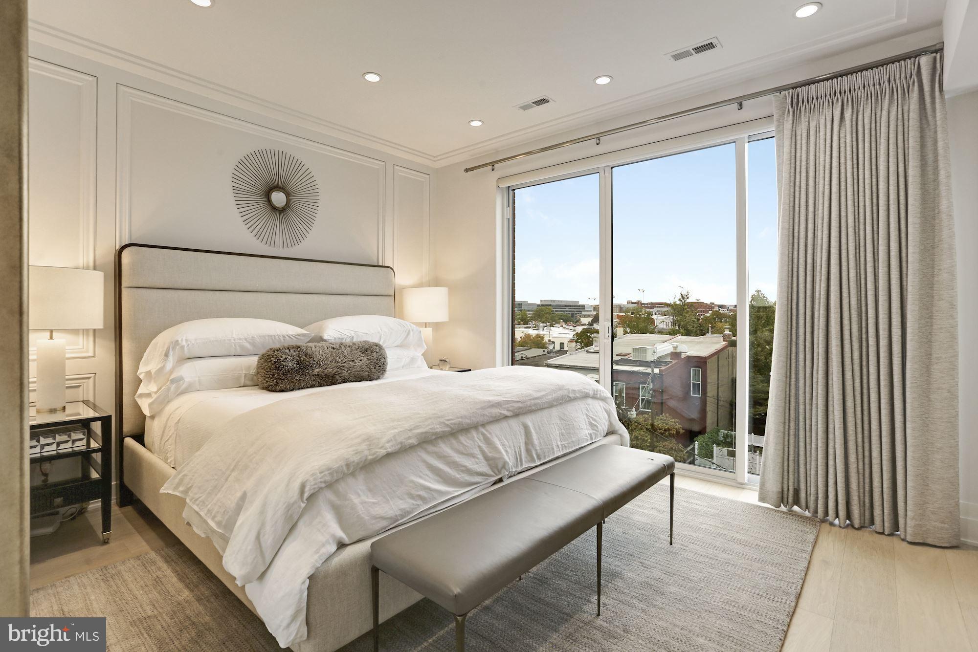 424 C Street Northeast Washington, DC 20002 - Photo 21 of 26 a bedroom with a bed and a large window