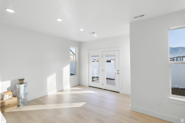 537 South Rivergate Drive Logan, UT 84321 - Photo 16 of 20 Bright interior space featuring light wood-finish flooring, recessed ceiling lighting, and multiple windows