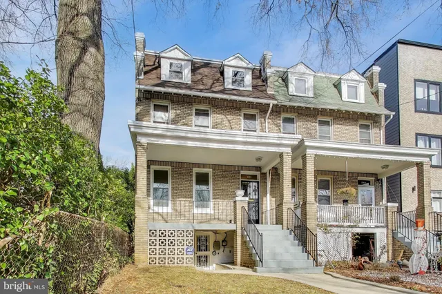 a balcony with furniture and flowers