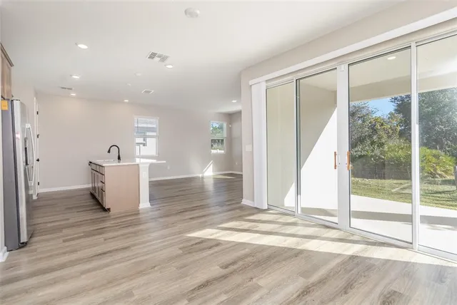 a view of a kitchen with a sink and a window