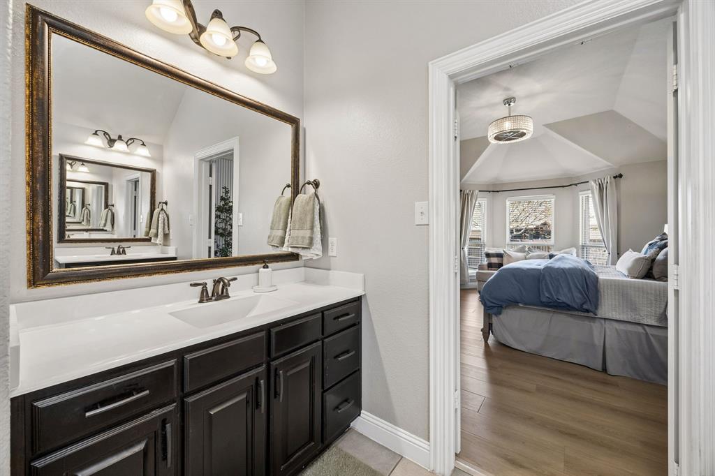 3917 Gatewick Drive Rockwall, TX 75087 - Photo 16 of 34 a en suite bathroom with a double vanity sink and a mirror