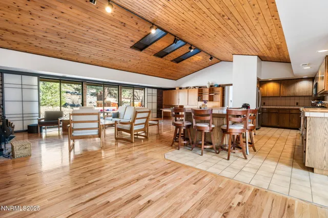 a kitchen with stainless steel appliances wooden cabinets a stove and a refrigerator