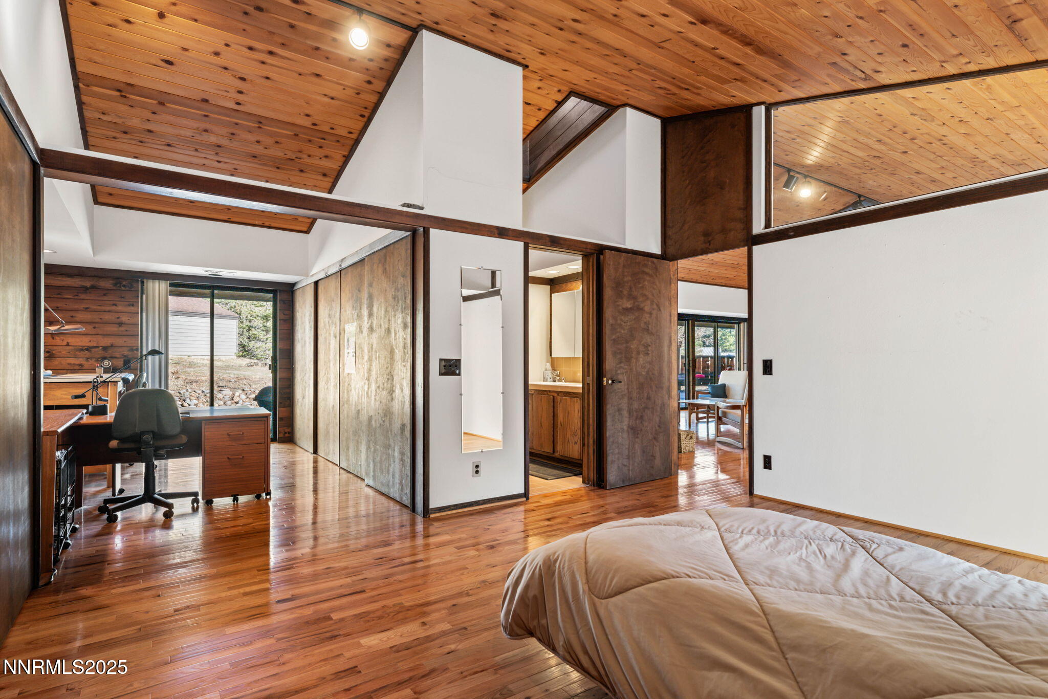 4650 Old Clear Creek Road Carson City, NV 89705 - Photo 32 of 59 a bedroom with furniture and wooden floor