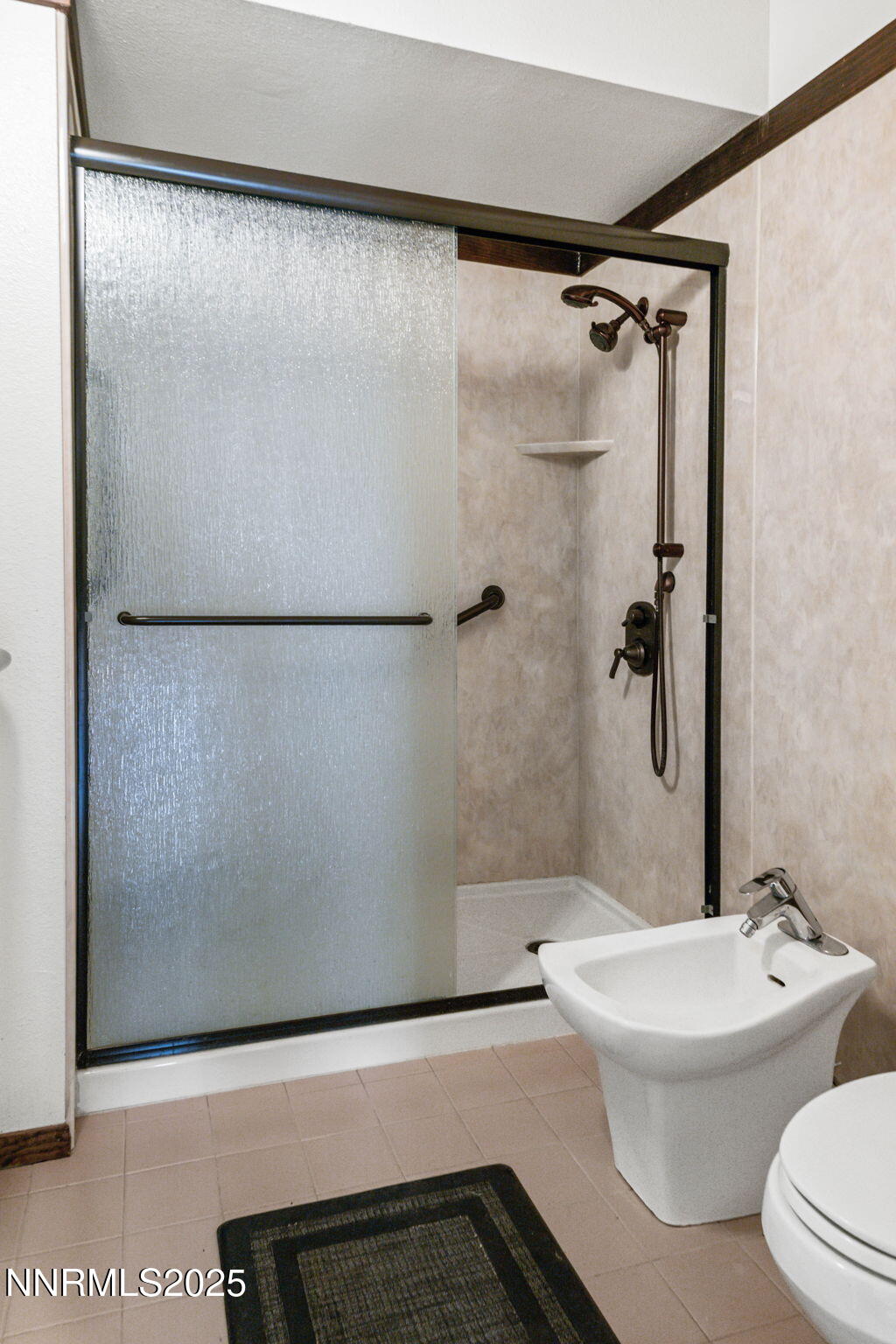 4650 Old Clear Creek Road Carson City, NV 89705 - Photo 34 of 59 a bathroom with a bathtub and a shower