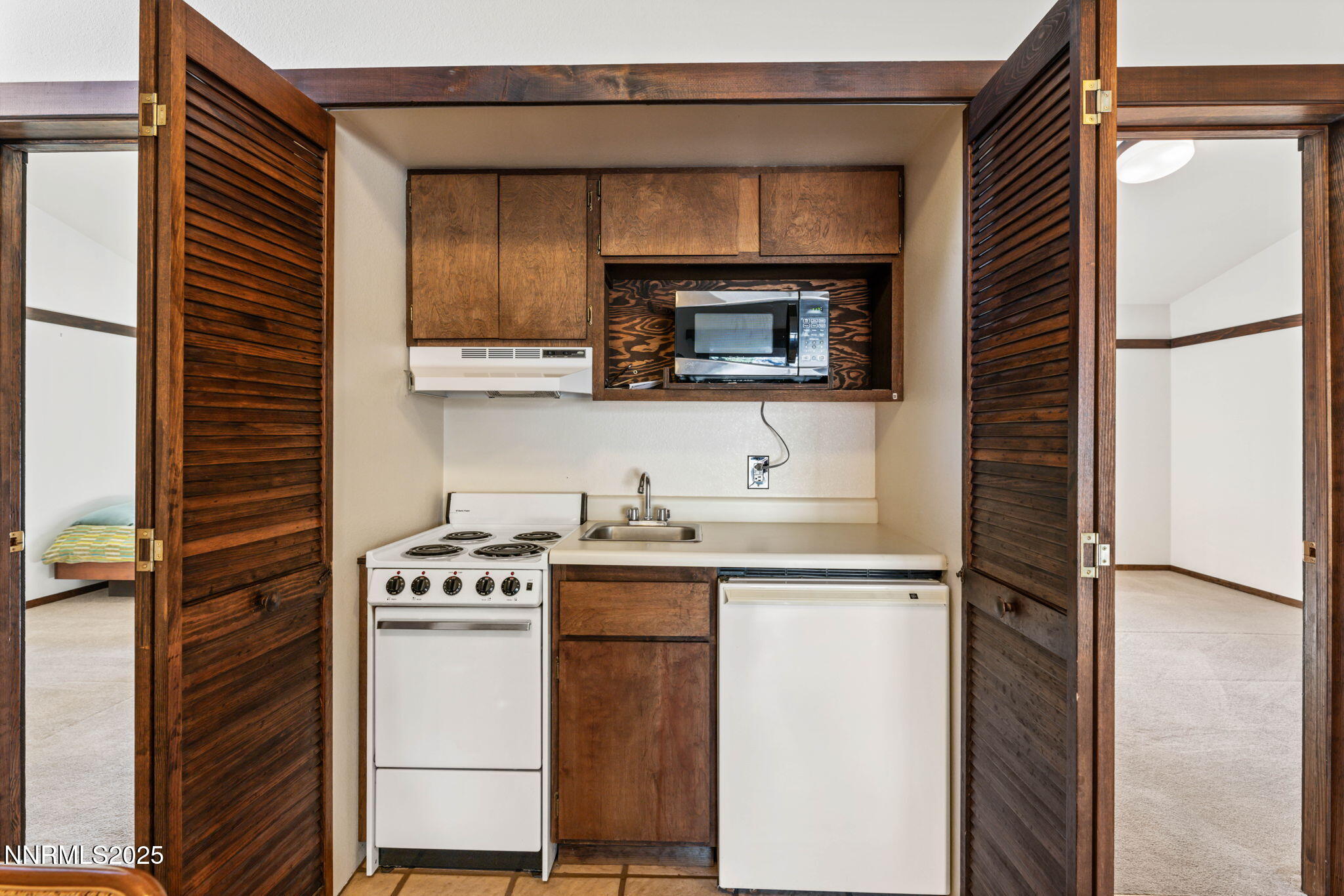 4650 Old Clear Creek Road Carson City, NV 89705 - Photo 41 of 59 a kitchen with a stove microwave and sink