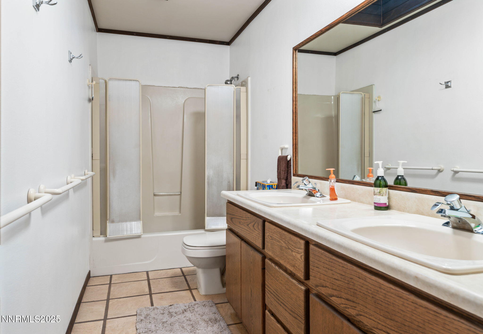 4650 Old Clear Creek Road Carson City, NV 89705 - Photo 47 of 59 a bathroom with a sink a toilet a mirror and shower