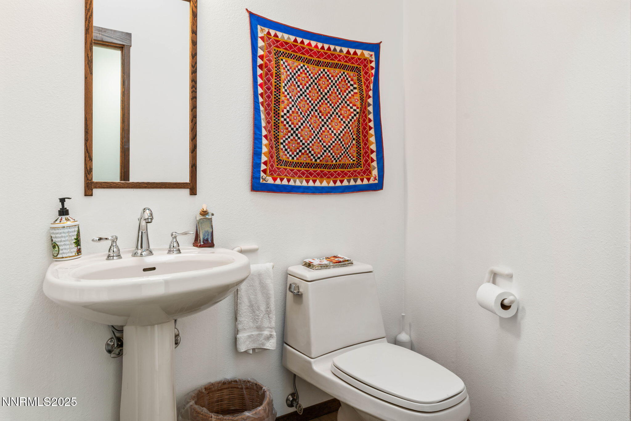 4650 Old Clear Creek Road Carson City, NV 89705 - Photo 49 of 59 a bathroom with a sink a mirror and a toilet