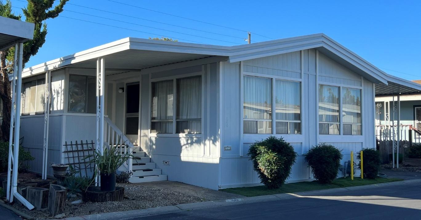 a front view of a house with garden