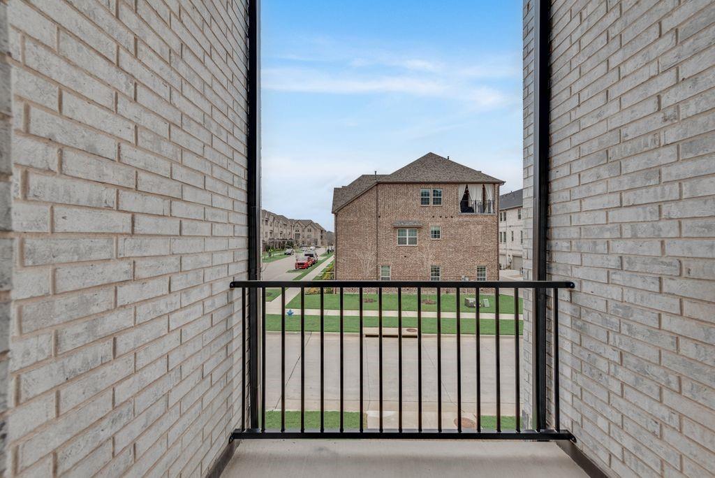 8159 Challenger Lane Frisco, TX 75034 - Photo 15 of 36 a view of a brick house with a small yard