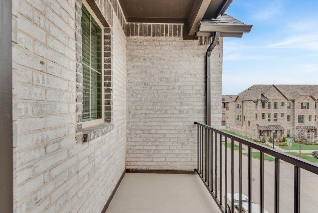 8159 Challenger Lane Frisco, TX 75034 - Photo 16 of 36 a view of a brick house with a window