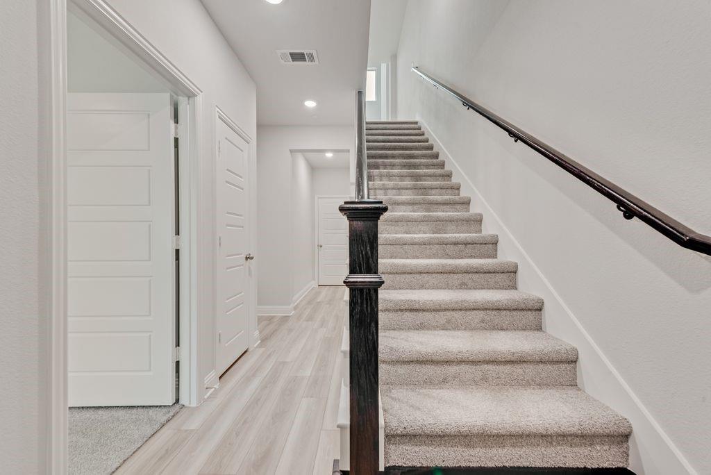 8159 Challenger Lane Frisco, TX 75034 - Photo 18 of 36 a view of entryway and hall with wooden floor