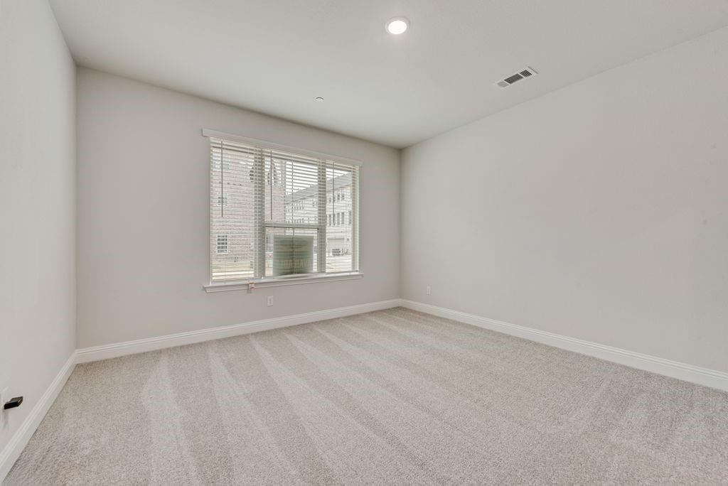 8159 Challenger Lane Frisco, TX 75034 - Photo 21 of 36 a view of an empty room with a window