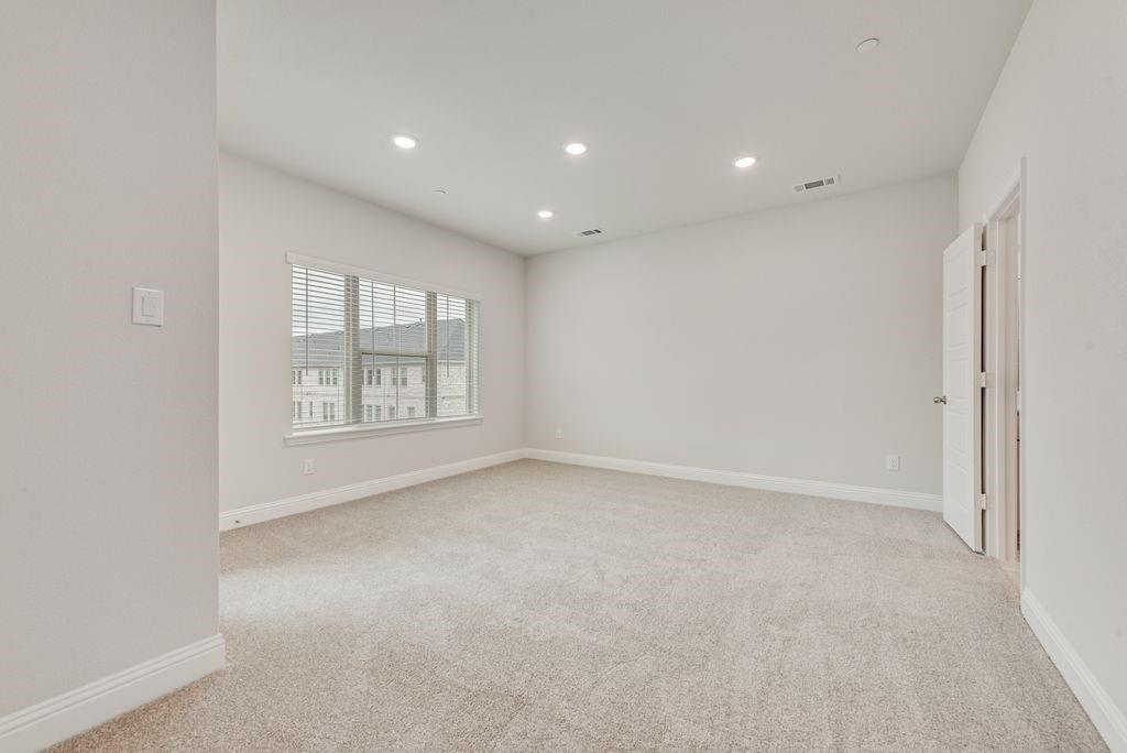 8159 Challenger Lane Frisco, TX 75034 - Photo 24 of 36 an empty room with windows