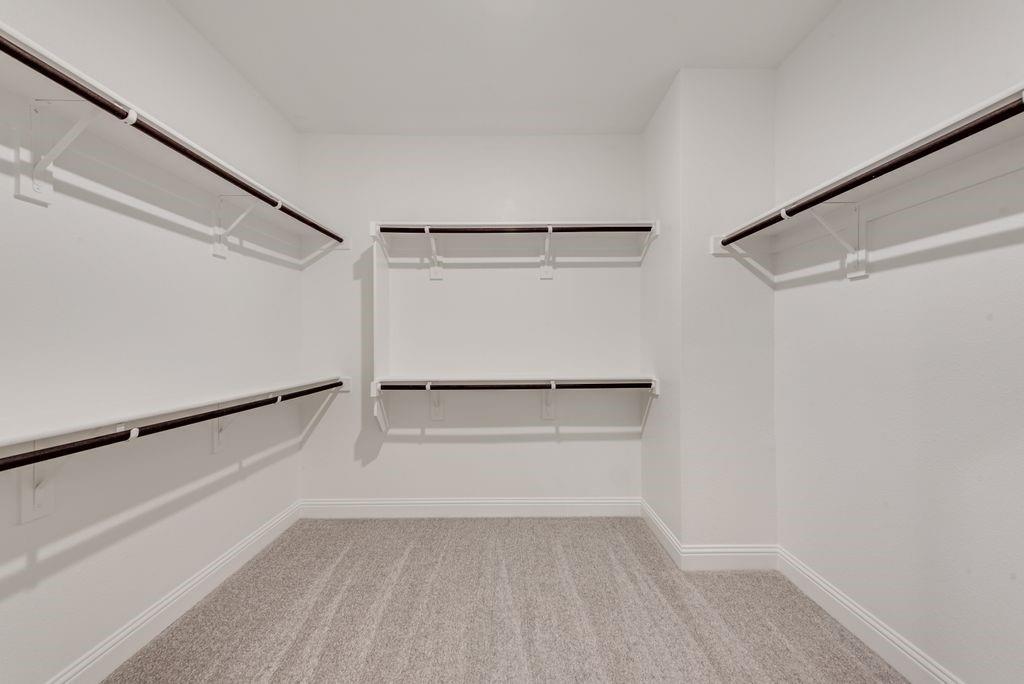 8159 Challenger Lane Frisco, TX 75034 - Photo 27 of 36 a view of an empty walk in closet