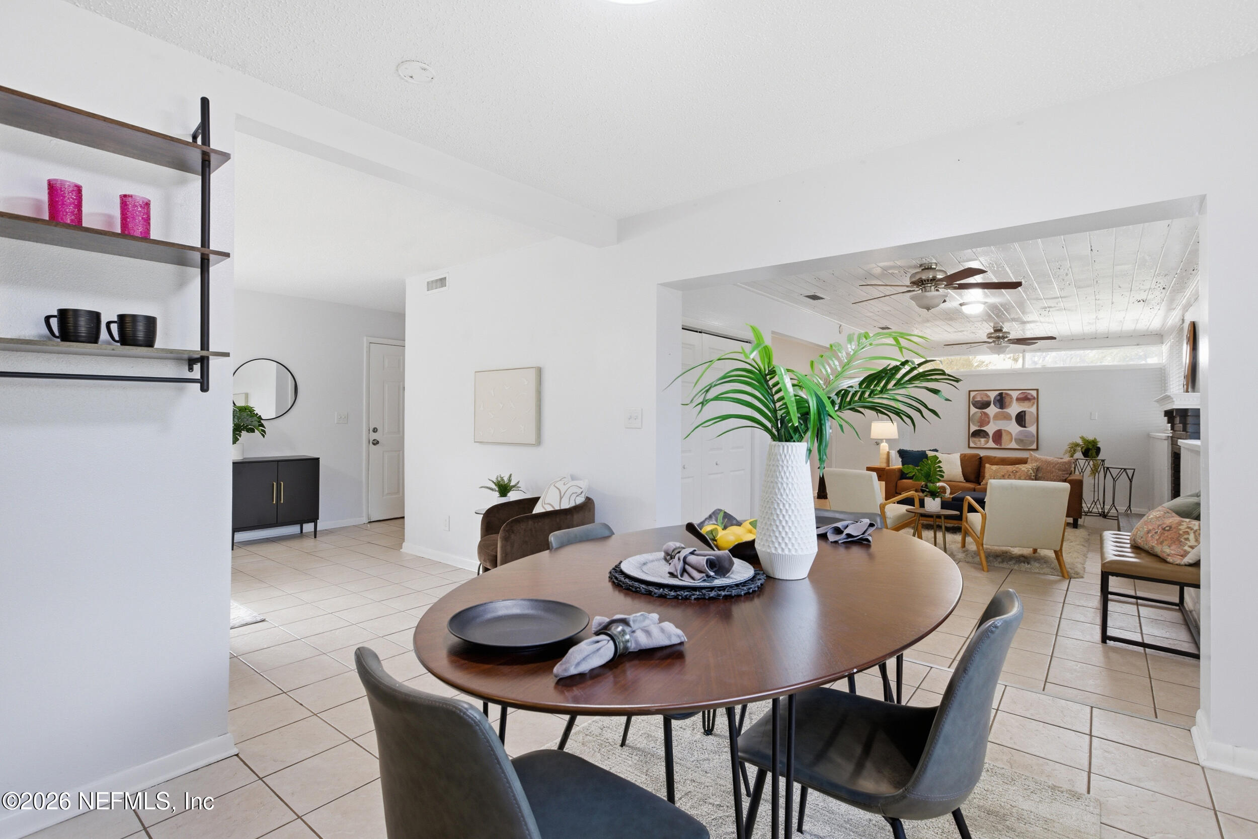 6231 Riviera Manor Drive Jacksonville, FL 32216 - Photo 5 of 33 a view of a dining room with furniture and chandelier