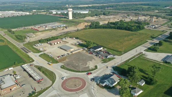 an aerial view of a house with a lake view