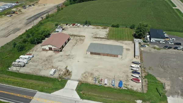 an aerial view of a house with outdoor space