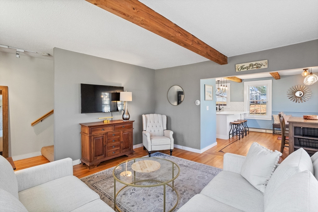 16 Main Street, Unit 3 Pepperell, MA 01463 - Photo 14 of 30 a living room with furniture and a flat screen tv