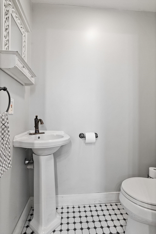 16 Main Street, Unit 3 Pepperell, MA 01463 - Photo 15 of 30 a bathroom with a sink toilet and a mirror