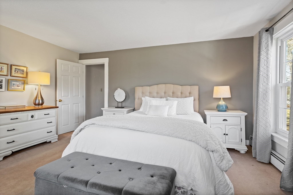 16 Main Street, Unit 3 Pepperell, MA 01463 - Photo 17 of 30 a bedroom with a bed and a dresser