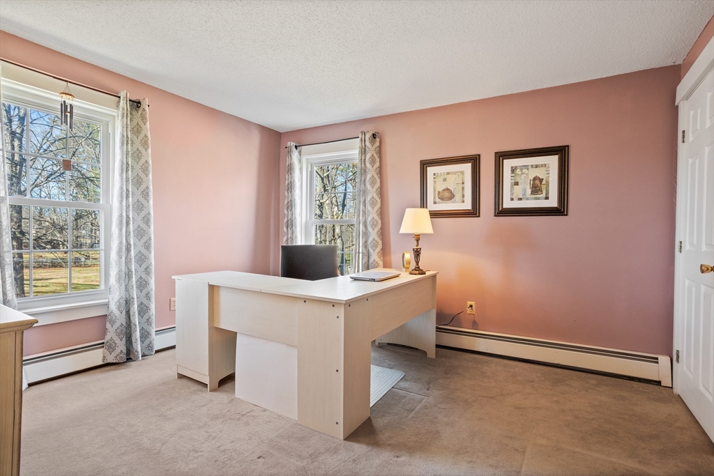 16 Main Street, Unit 3 Pepperell, MA 01463 - Photo 19 of 30 a view of workspace room with window and hallway