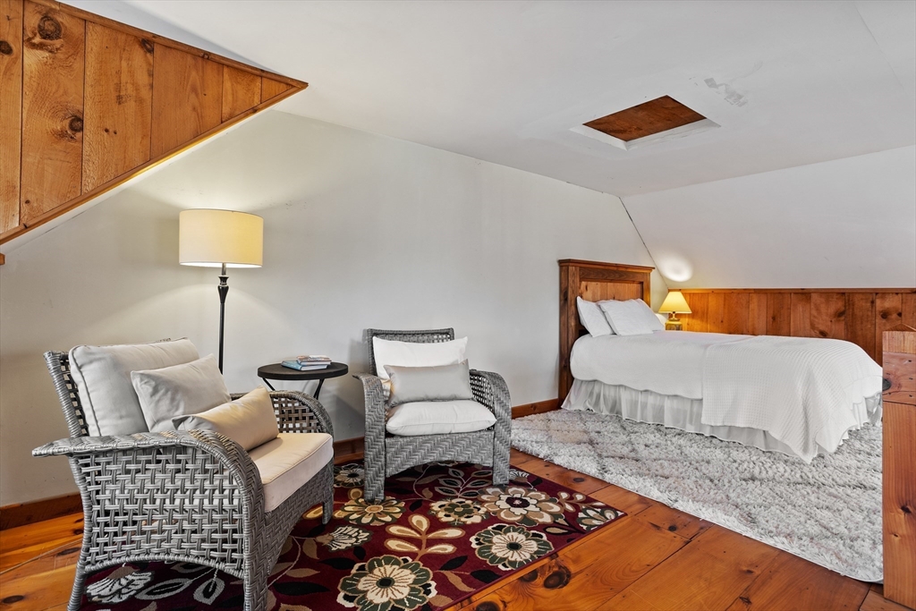 16 Main Street, Unit 3 Pepperell, MA 01463 - Photo 21 of 30 a bedroom with a bed and a lamp