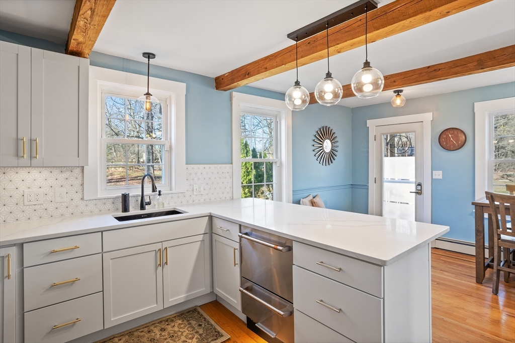 16 Main Street, Unit 3 Pepperell, MA 01463 - Photo 7 of 30 a very nice looking kitchen with a window a sink and cabinets