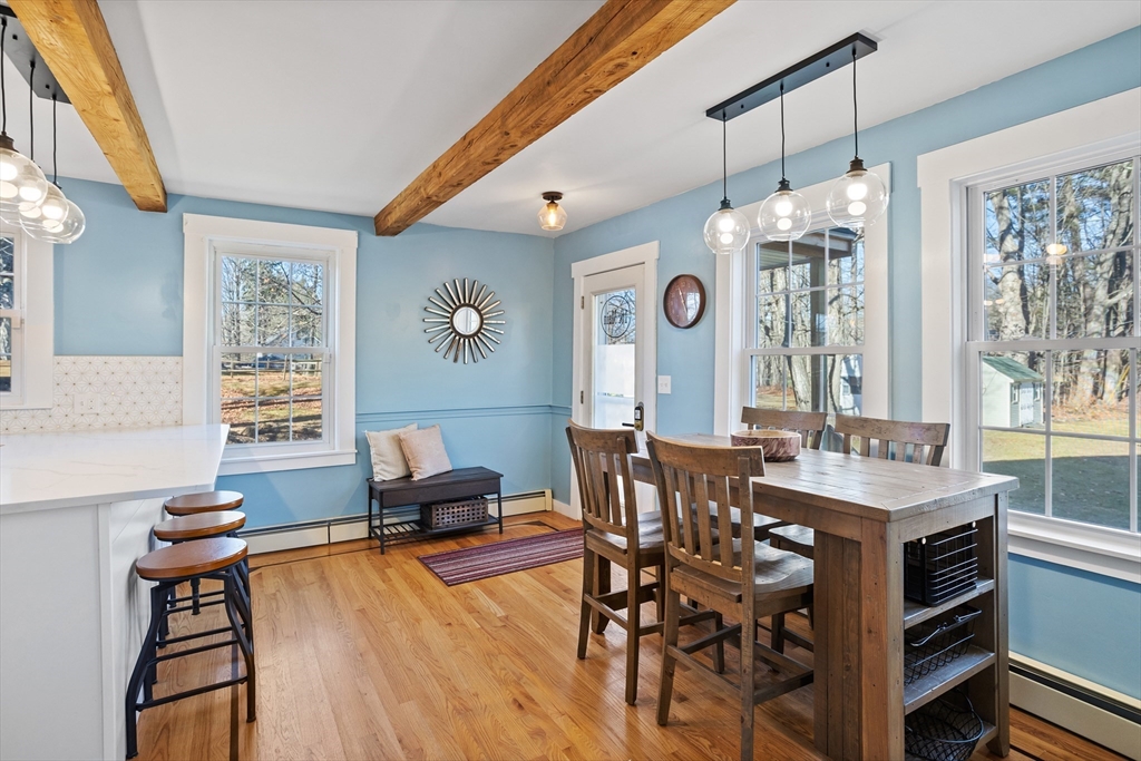 16 Main Street, Unit 3 Pepperell, MA 01463 - Photo 9 of 30 a view of a dining room with furniture window and wooden floor