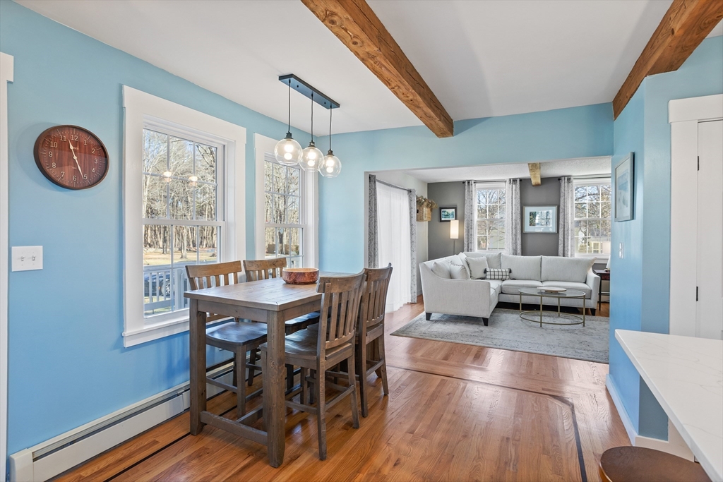 16 Main Street, Unit 3 Pepperell, MA 01463 - Photo 10 of 30 a view of a dining room with furniture a chandelier and wooden floor