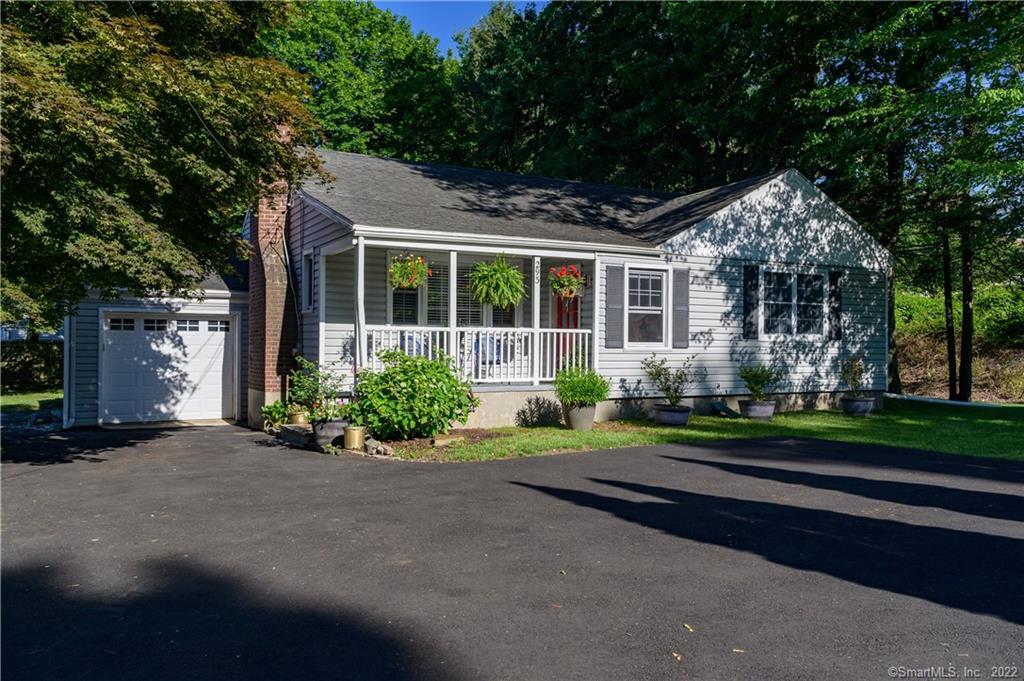 293 High Ridge Road Stamford, CT 06905 - Photo 1 of 1 a front view of a house with a yard and outdoor seating