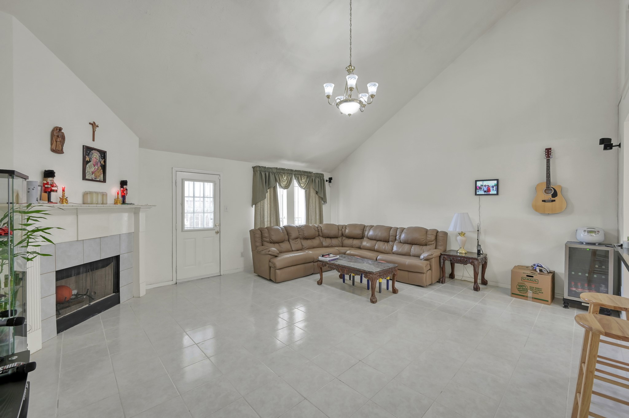 2539 Forge Creek Road Houston, TX 77067 - Photo 13 of 40 Living room with tile floors, high ceilings, and gas log fireplace.