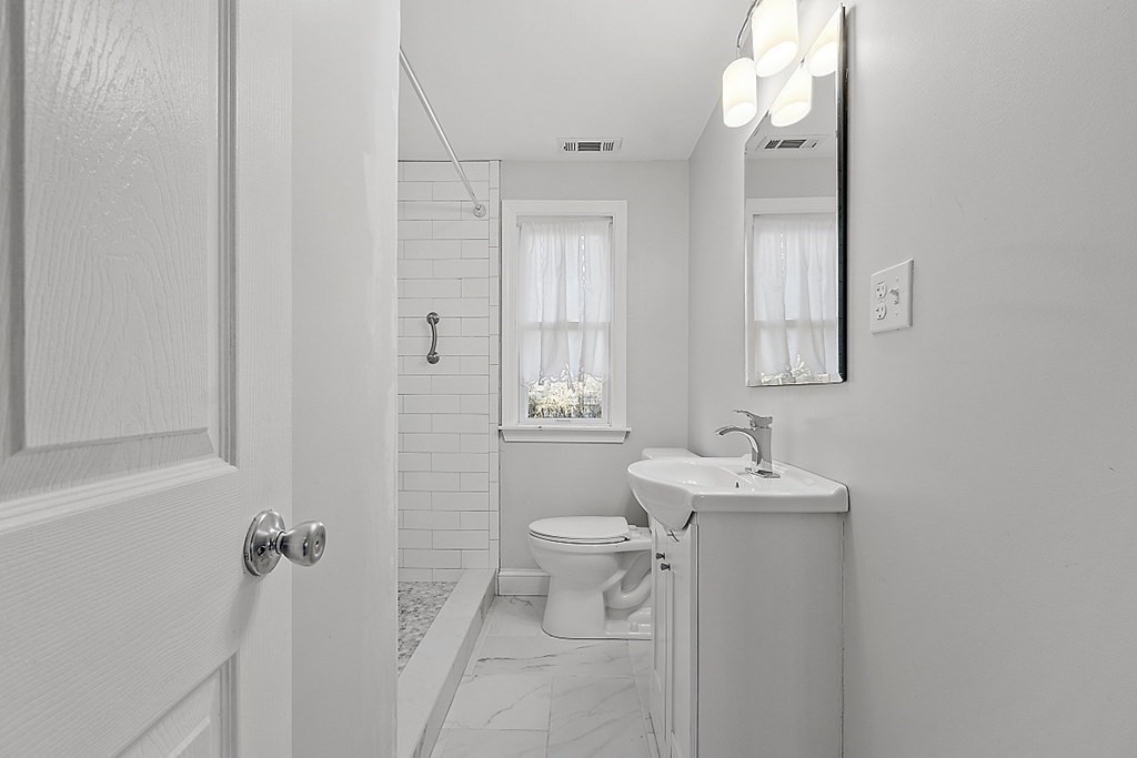 126 South Row Road Lunenburg, MA 01462 - Photo 12 of 28 a bathroom with a sink toilet and shower