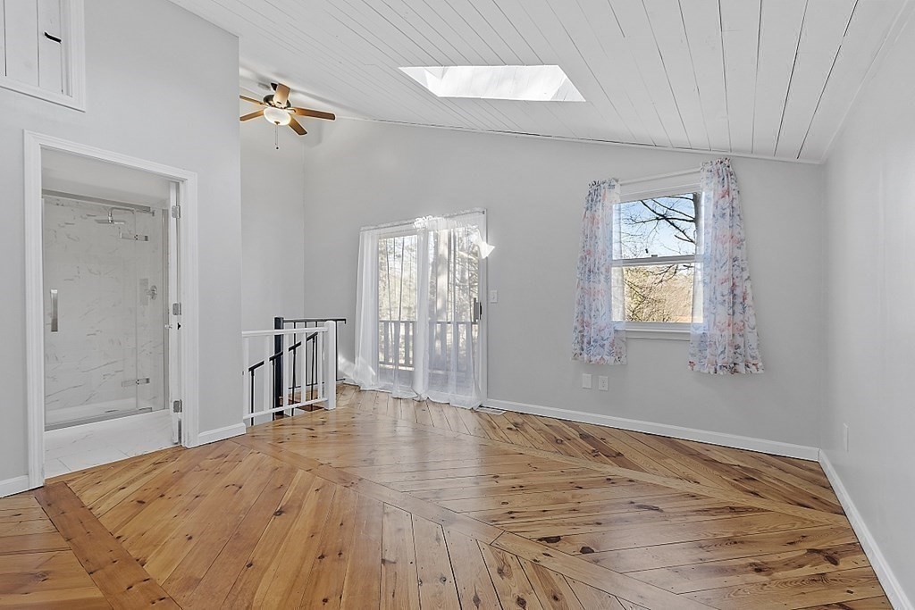 126 South Row Road Lunenburg, MA 01462 - Photo 15 of 28 an empty room with wooden floor and windows