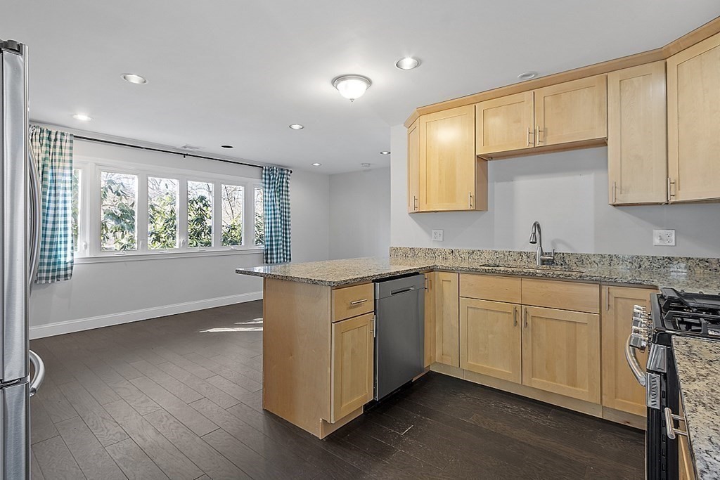 126 South Row Road Lunenburg, MA 01462 - Photo 5 of 28 a kitchen with granite countertop cabinets stainless steel appliances wooden floor and a window