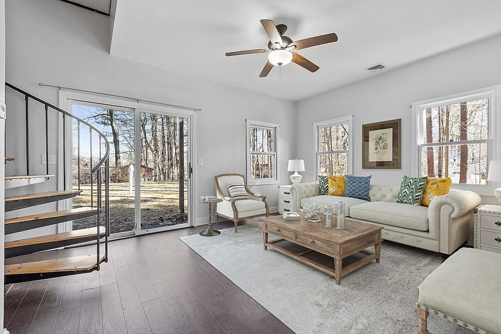 126 South Row Road Lunenburg, MA 01462 - Photo 8 of 28 a living room with furniture ceiling fan and a large window