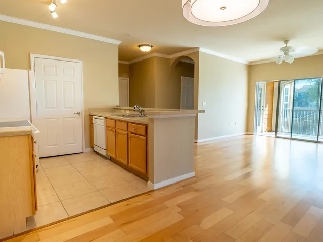 a kitchen with stainless steel appliances granite countertop a stove and a refrigerator