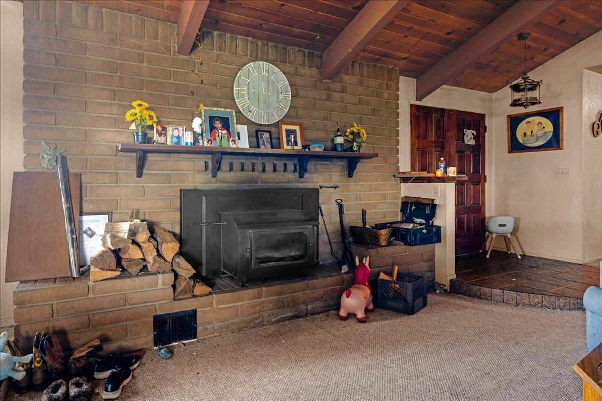 16860 Mark Road Madera, CA 93636 - Photo 23 of 76 a living room with furniture and a fireplace