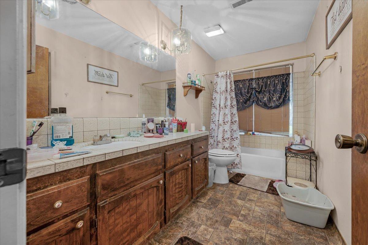 16860 Mark Road Madera, CA 93636 - Photo 36 of 76 a spacious bathroom with a sink a toilet and shower