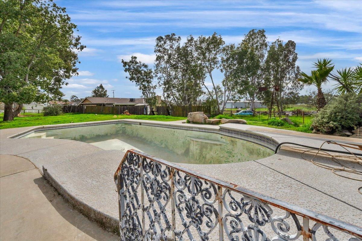 16860 Mark Road Madera, CA 93636 - Photo 41 of 76 a view of swimming pool with outdoor seating and plants