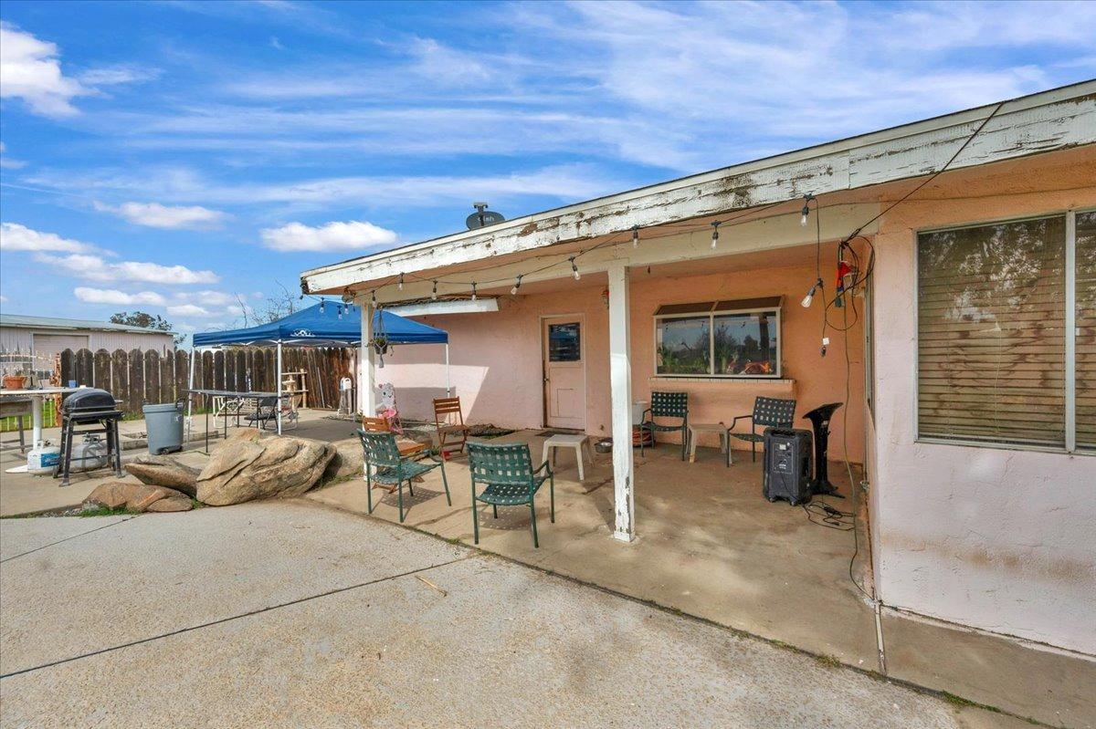 16860 Mark Road Madera, CA 93636 - Photo 48 of 76 a view of a patio with couches chairs and potted plants