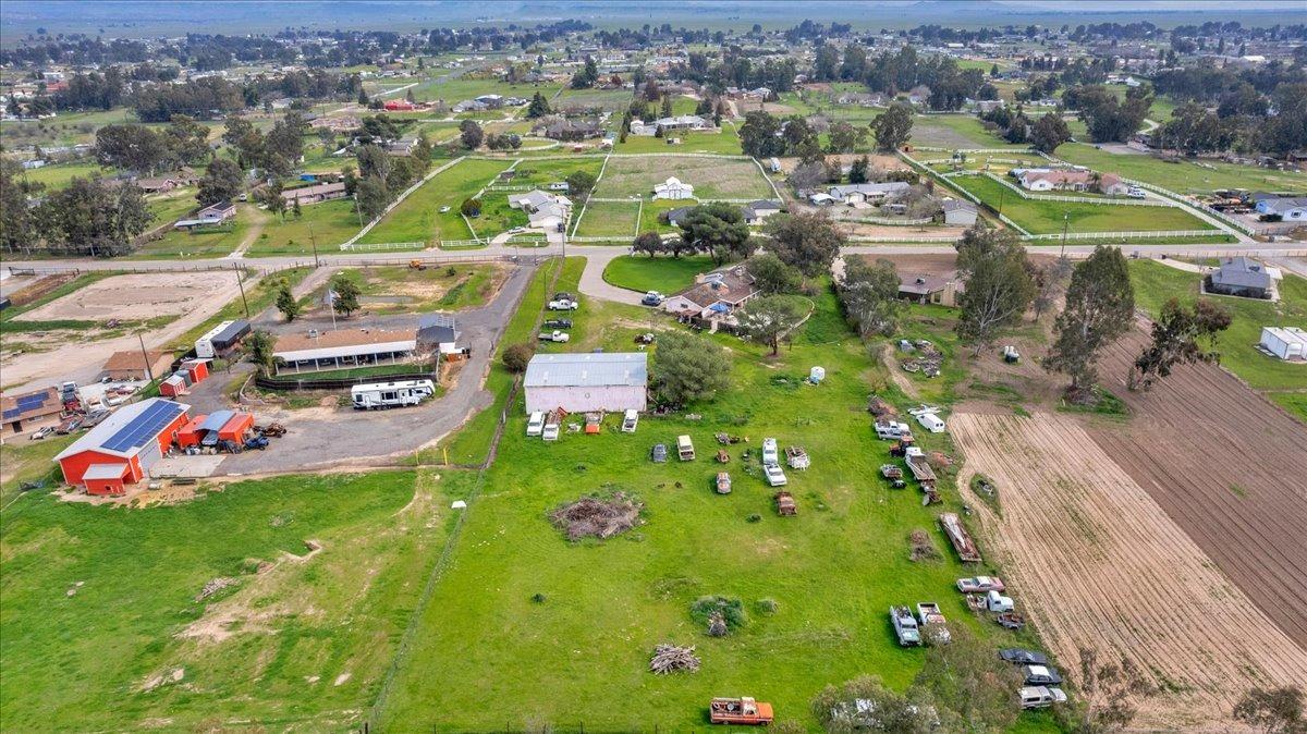 16860 Mark Road Madera, CA 93636 - Photo 54 of 76 an aerial view of residential houses with outdoor space