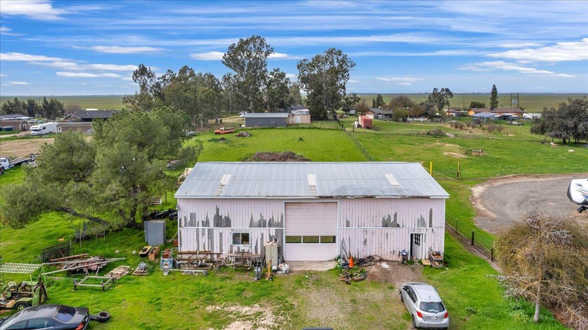 16860 Mark Road Madera, CA 93636 - Photo 61 of 76 an aerial view of a house with a garden and lake view