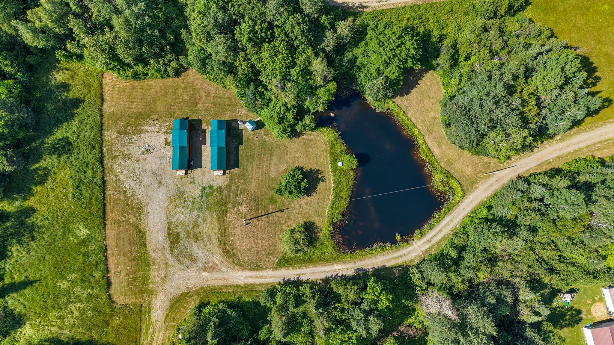 824 Shin Pond Road Patten, ME 04765 - Photo 15 of 49 dji_fly_20260712_155710_0866_17838862376
