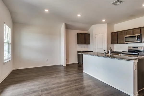 a large kitchen with cabinets