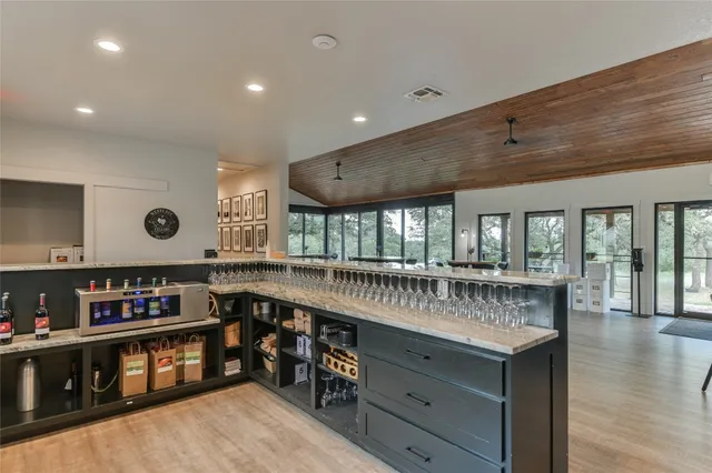 a kitchen with stainless steel appliances granite countertop a lot of counter space and a sink