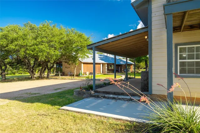 a view of a backyard with a small cabin