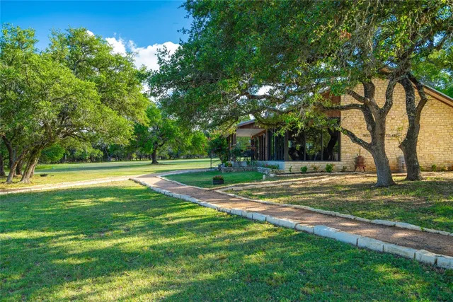 a view of a house with a big yard