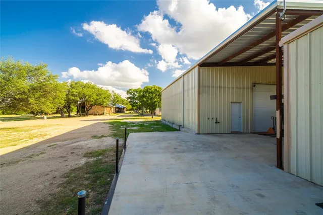 a view of a backyard of the house